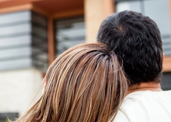 Loving couple looking at their dream house image